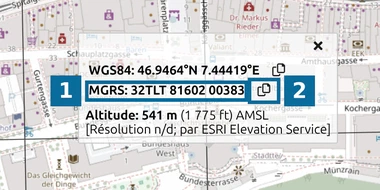Fiche de coordonnées map.army avec les lignes WGS84 et MGRS du Palais fédéral et un bouton Copier à côté de chacune